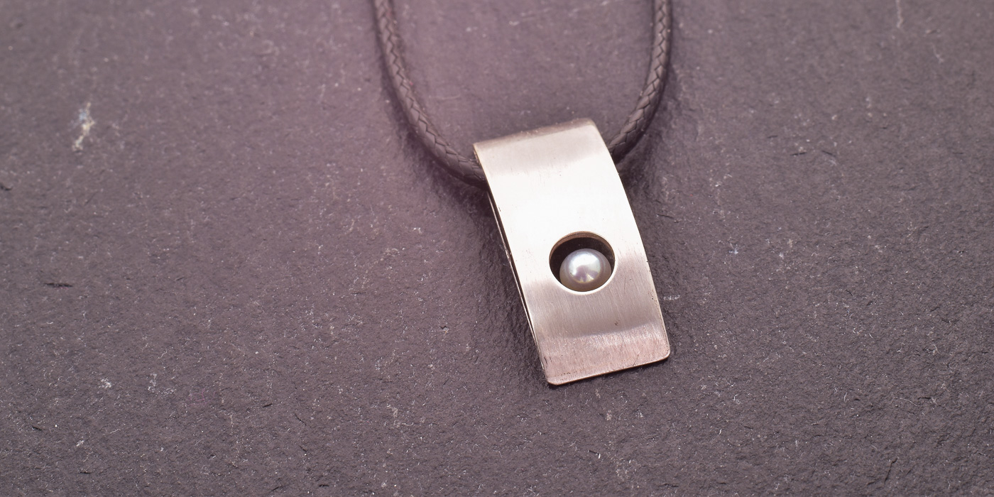 Anhänger gefangene Perle Header